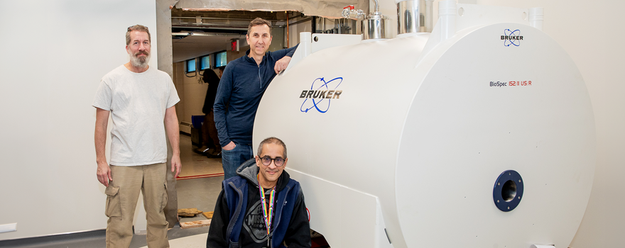 Joe Gati and Ravi Menon pose in front of newly installed 15.2T MRI system