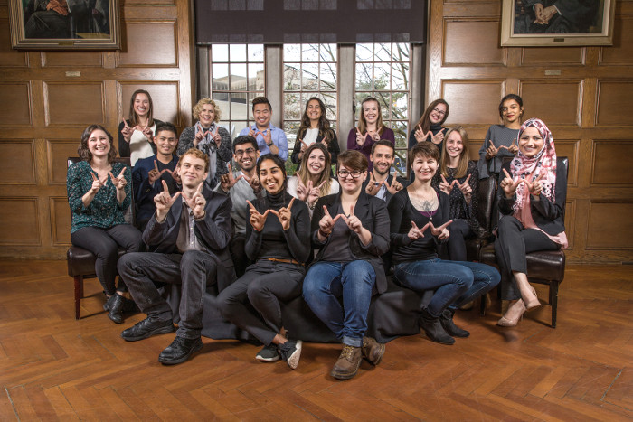 Undergraduate Awards Group Photo of students holding their hands in a "W" symbol, for Western