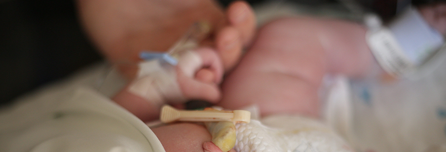 Newborn baby with monitors in nicu