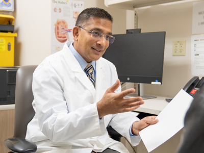 Dr. Amit Garg with patient