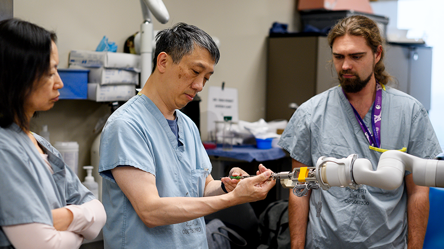 Dr. Victor Yang and team working on robot