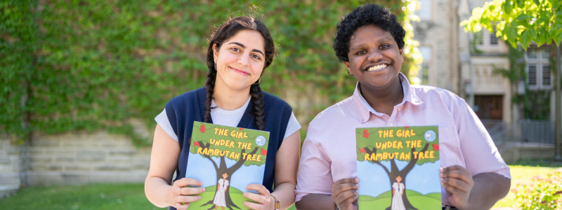Students Nadith Ranasinghe and Bahareh Rahimi Shahmirzadi with their books.