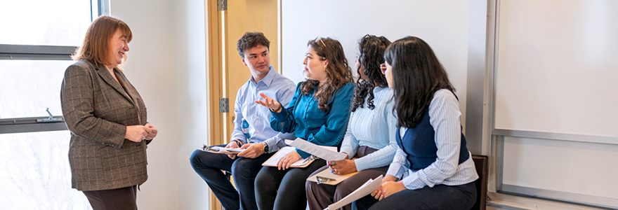 Cheryl Currie, PhD, (left) speaks with students in the Master of Public Health program at Schulich School of Medicine & Dentistry. The new program expands training to the undergraduate level, giving students a comprehensive and interdisciplinary foundation. (Megan Morris/Schulich Medicine & Dentistry)
