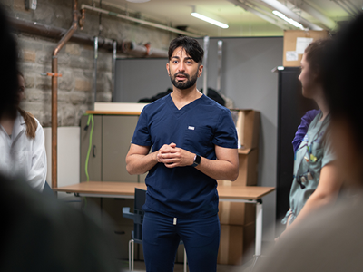 Dr. Abbas Jessani speaks at a community clinic hosted by Youth Opportunities Unlimited