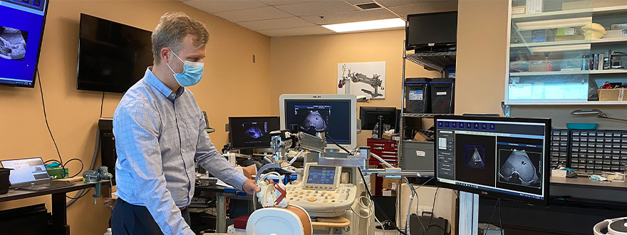 Dr. Derek Cool demonstrating the new robotic 3D ultrasound system