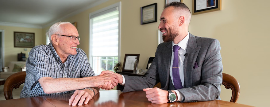 Dr. Hugh Allen meets with Omar Nawara in his London, Ontario home