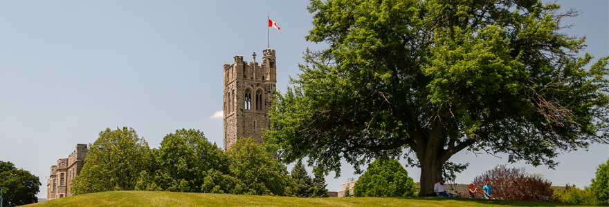 University College with Canadian flag and tree