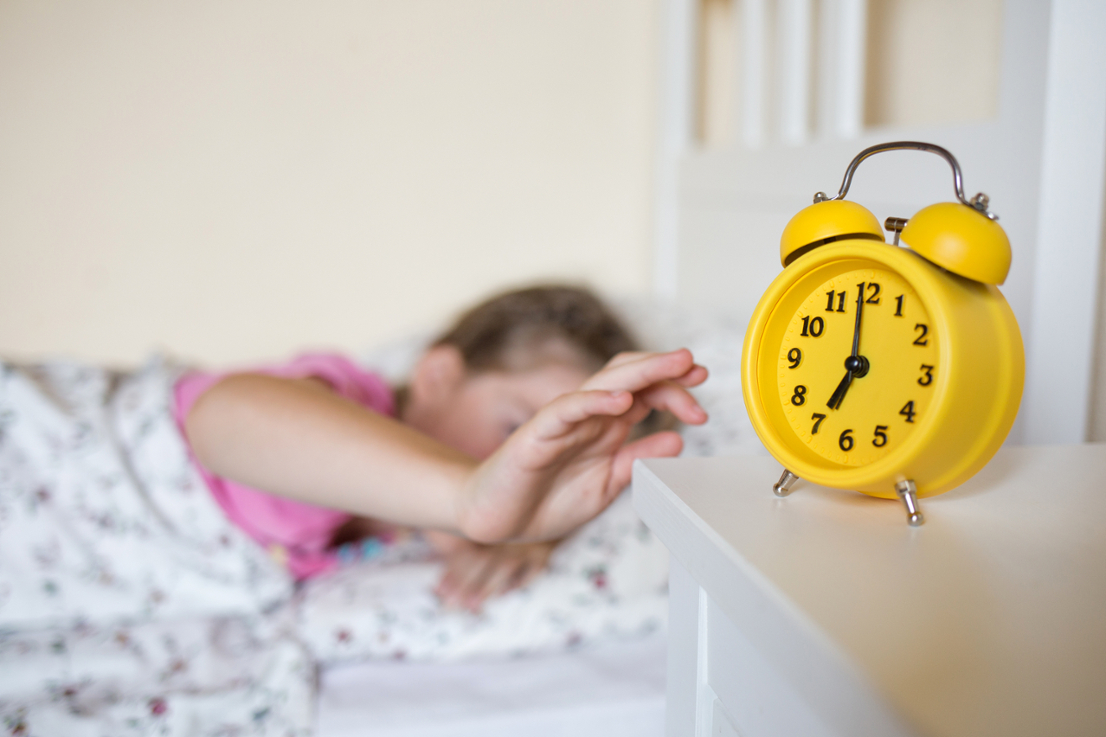 school child sleeps in bed