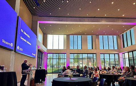 photo of Dr. John Dick giving keynote lecture at Sanwal event