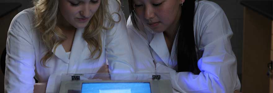 two students looking at DNA gel