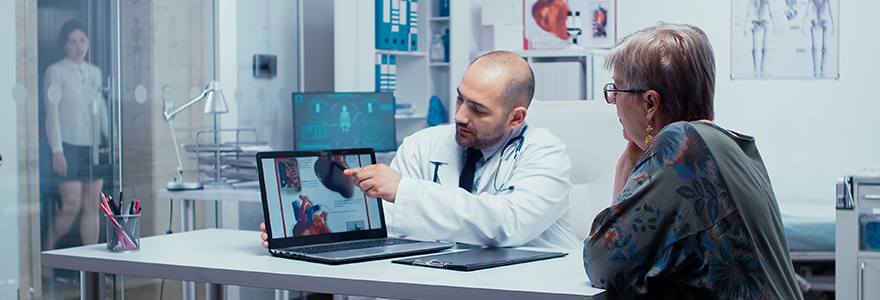 Photograph of Doctor explaining possible heart disease to patient