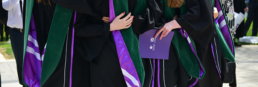 Photograph of students wearing their graduation robes