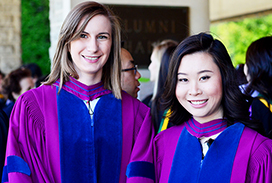 Photograph of two master students graduating