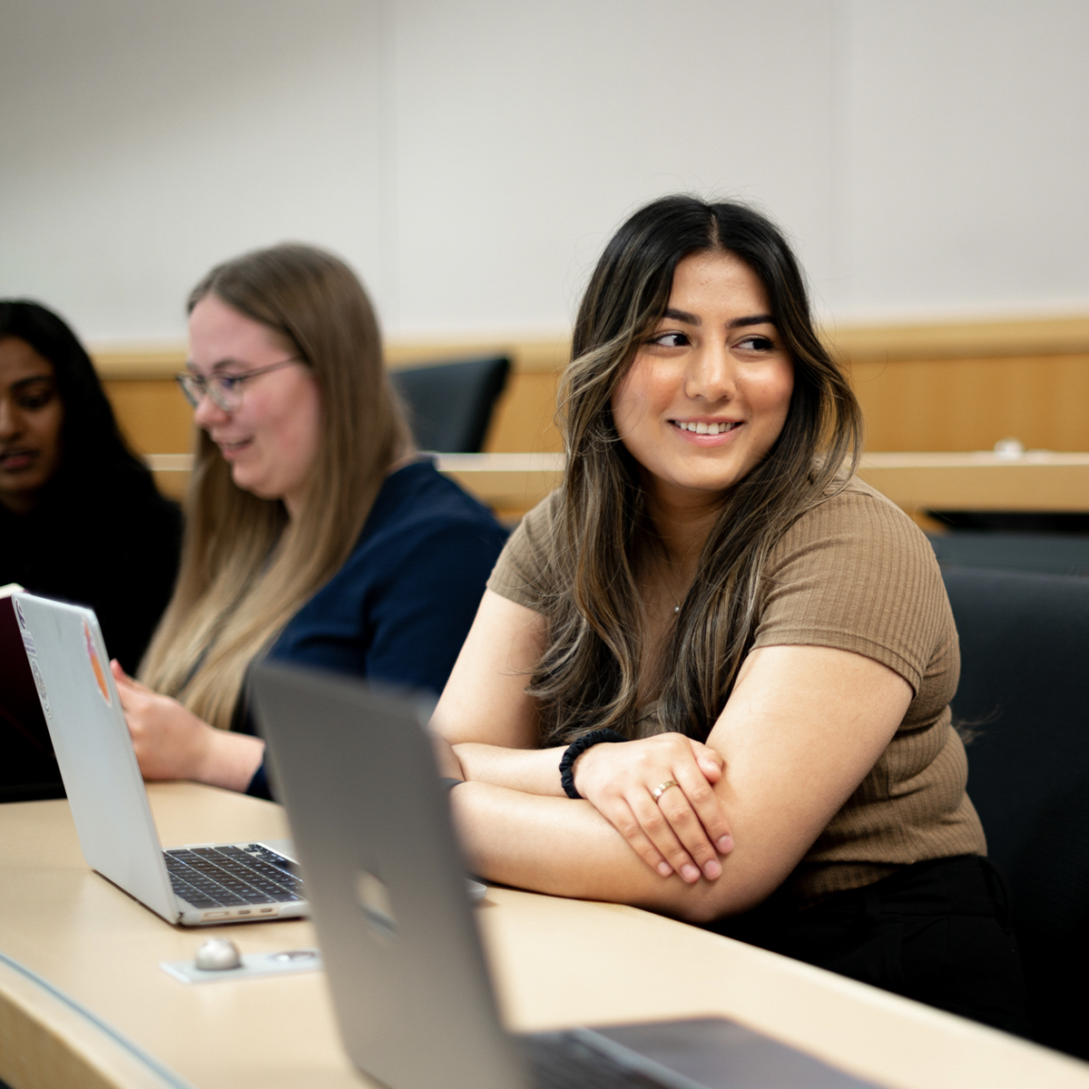Students in conversation in a lecture hall