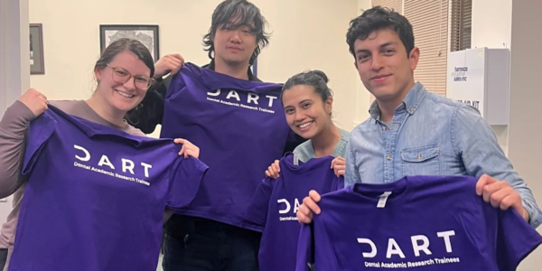 DART participants holding up purple DART t-shirts