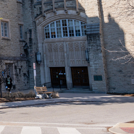 Wide view of the Medical Sciences Building exterior under a blue sky