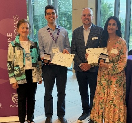 Mrs. Toula Gerace and Dr. Scott McKay presented the  Dr. John F. Sangster Graduate Studies Family Medicine Award to Drs. Thiago Lopes (MClSc) and Sakina Walji (PhD)