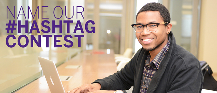 Student on his laptop smiling for the camera