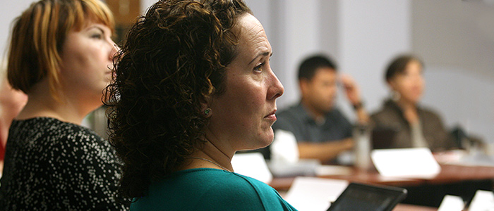 Staff sitting around a table