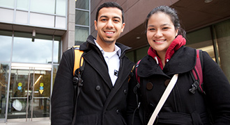 Undergraduate medical students standing in front of a building
