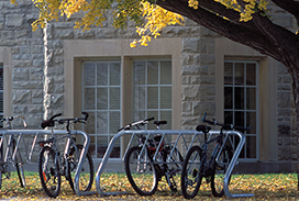 Photograph of bike rack infront of a campus building