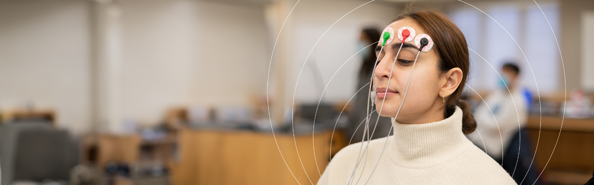 Student wearing EEG sensors during a lab experiment.