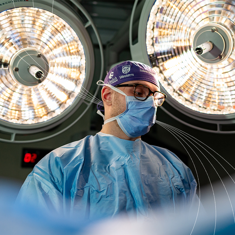 With a background in music, fourth-year general surgery resident Dr. Cohen Chaulk draws on skills he honed as a pianist. He is pictured in an operating room at London Health Sciences Centre.