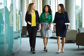 Three female physicians walking