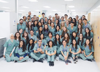Members of the Dentistry Class of 2021 posing in the Simulation Lab