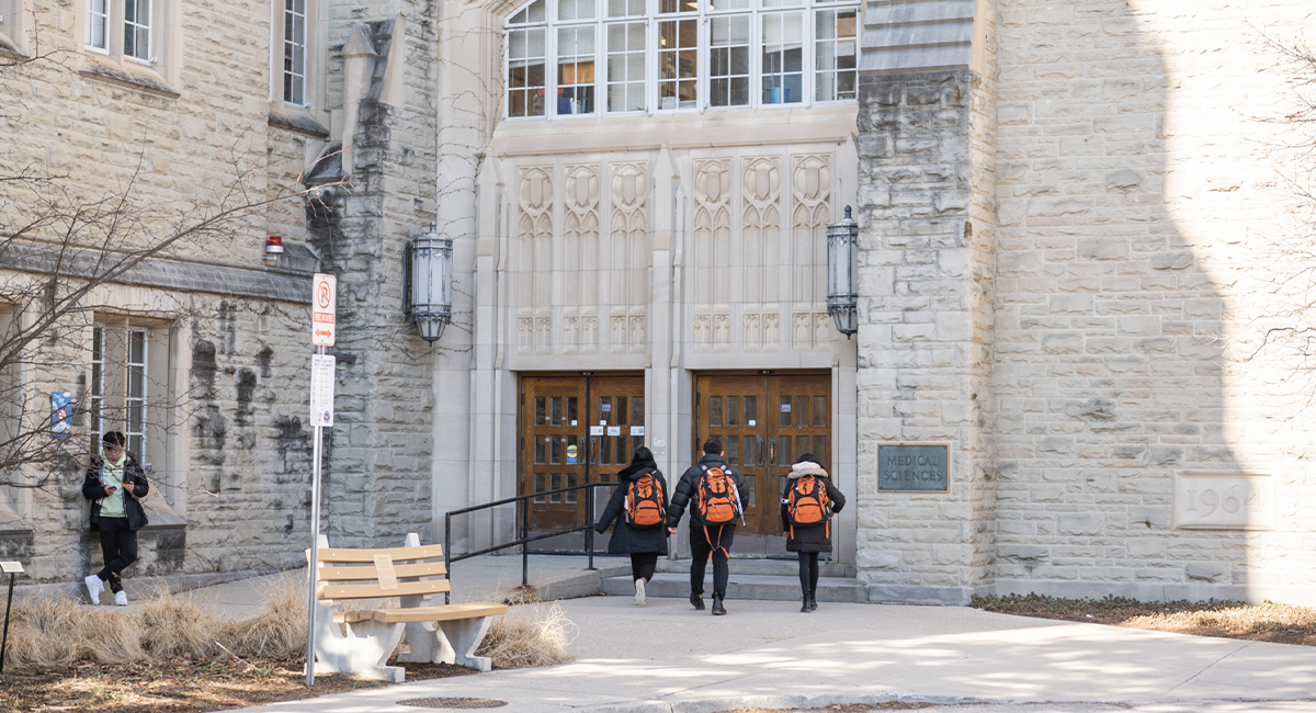 Students walking toward the Medical Sciences Building entrance