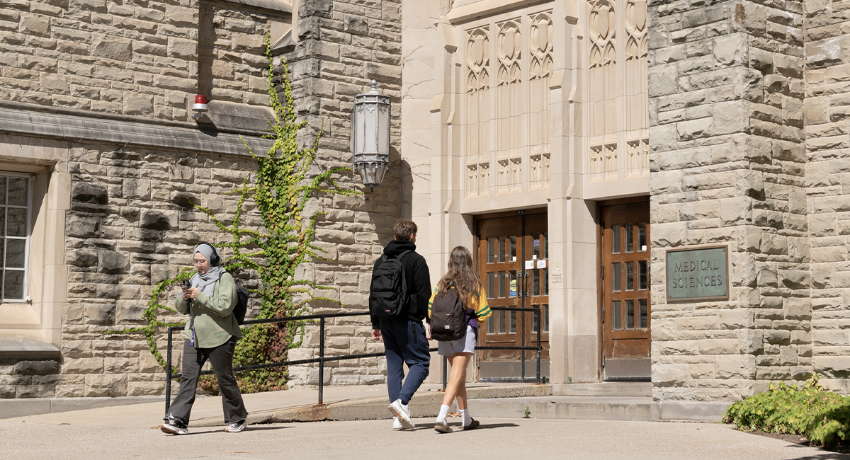 Students walking past the Medical Sciences Building entrance