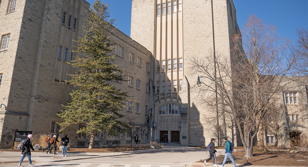 Medical Sciences Building exterior with students walking nearby