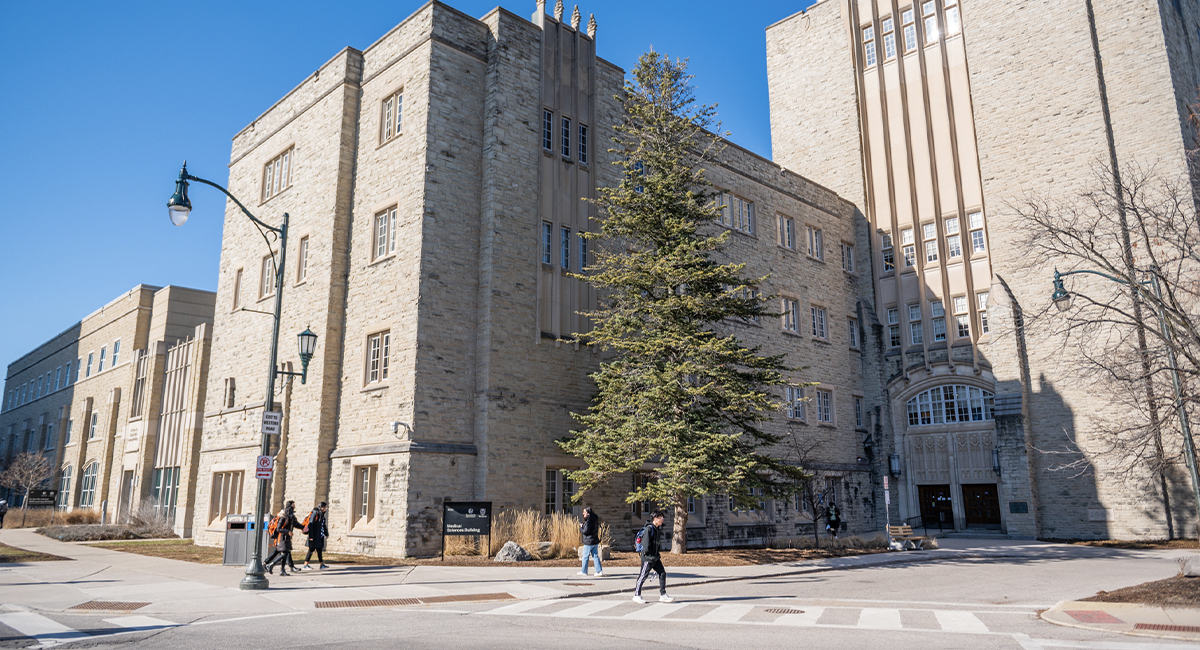 Wide view of the Medical Sciences Building exterior under a blue sky