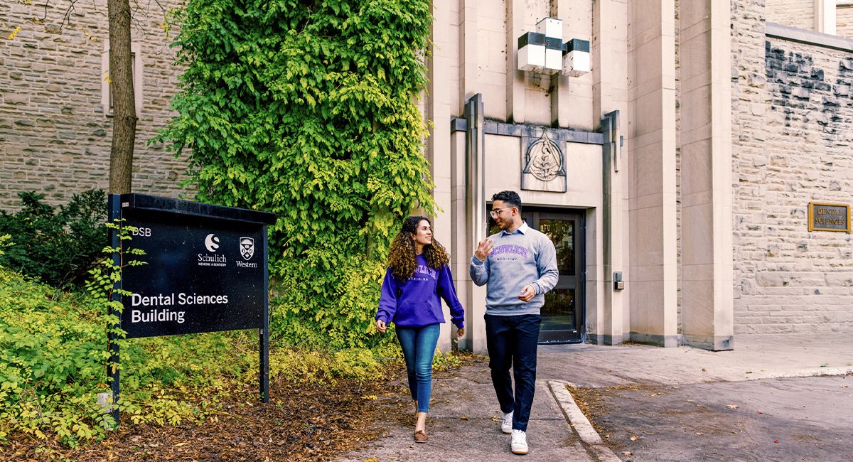 Students walking toward a campus building entrance