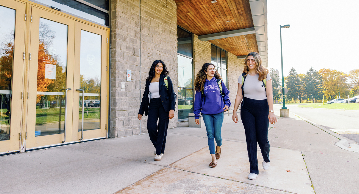 Students walking outside a campus building