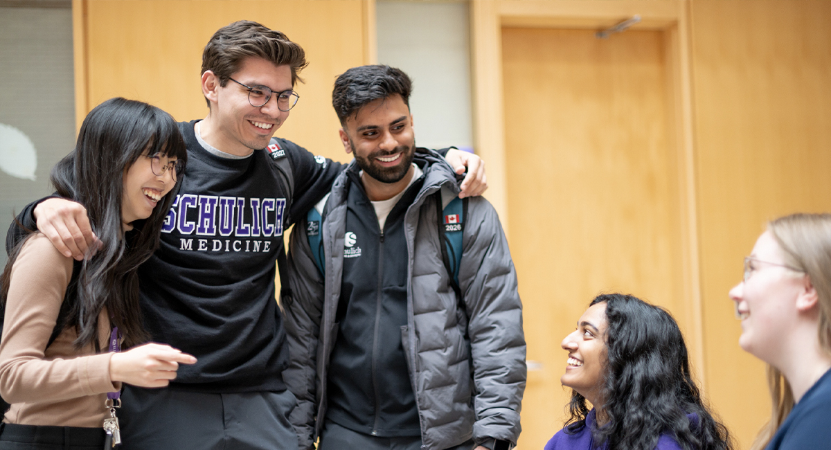 Students chatting together indoors in a common area