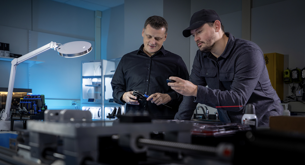 Two staff members reviewing equipment in a research lab