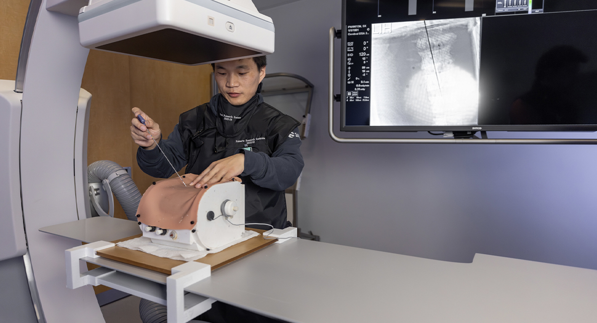 Student using imaging equipment with a training mannequin