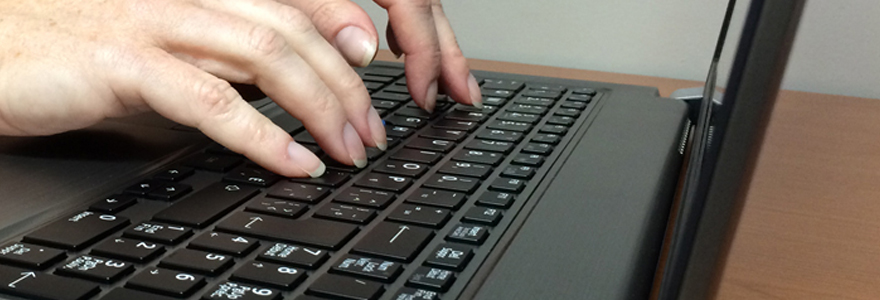 Image of hands typing on a keyboard