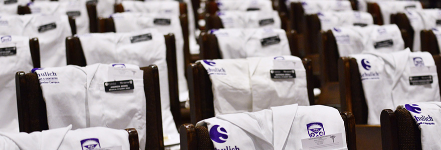 white coats draped over chairs