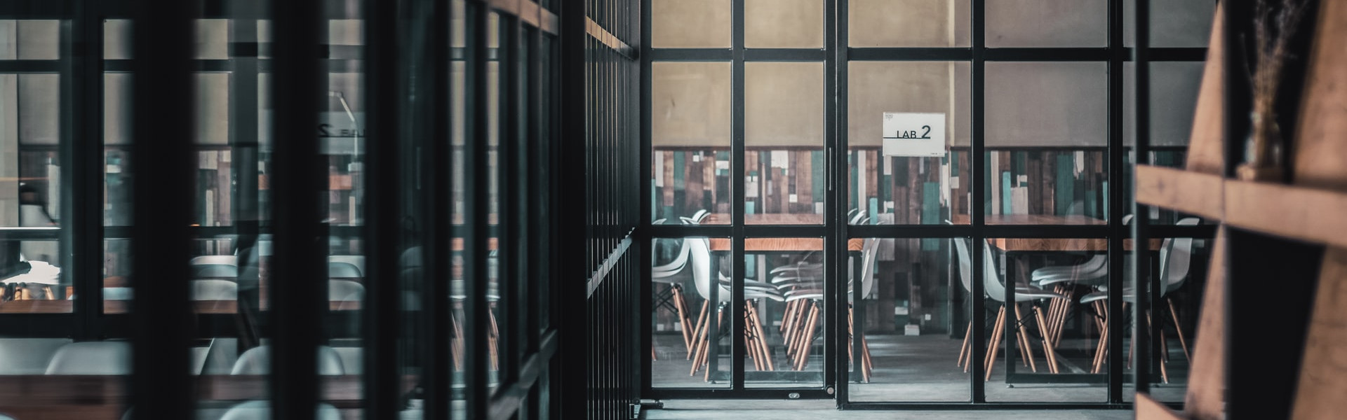 room and hallway seen through glass walls