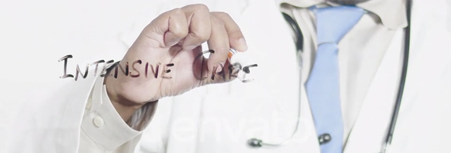 Physician wearing a white coat writing words "Intensive Care"