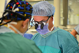 Photograph of a physician wearing greens in the OR
