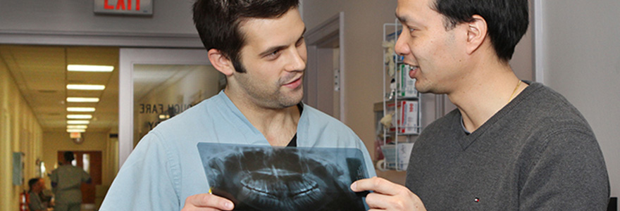 OMFS student reviewing an x-ray with a DDS student