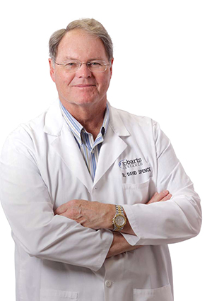 Photograph of Dr. David Spence wearing a white coat