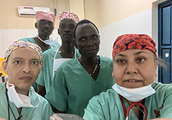 Image of Dr. Dhir in South Sudan with staff