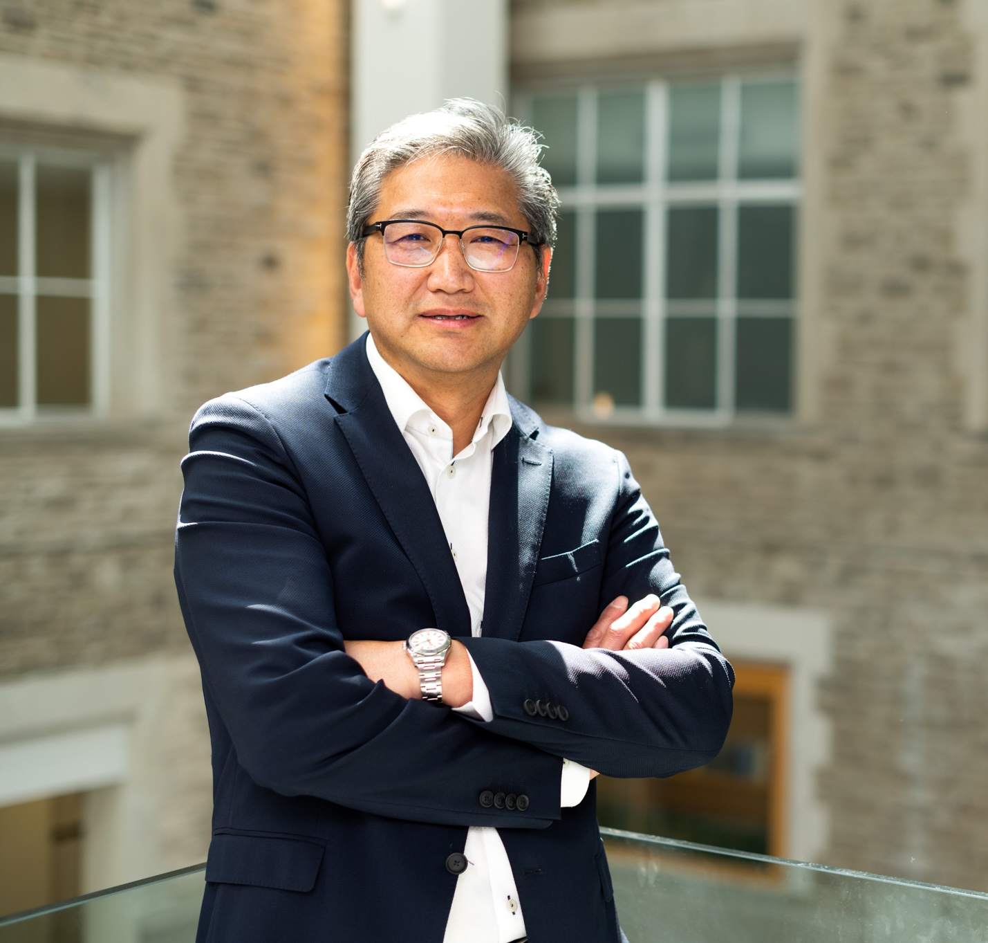 Dr. John Yoo, Dean of Schulich School of Medicine & Dentistry, standing on a balcony overlooking Health Sciences Addition