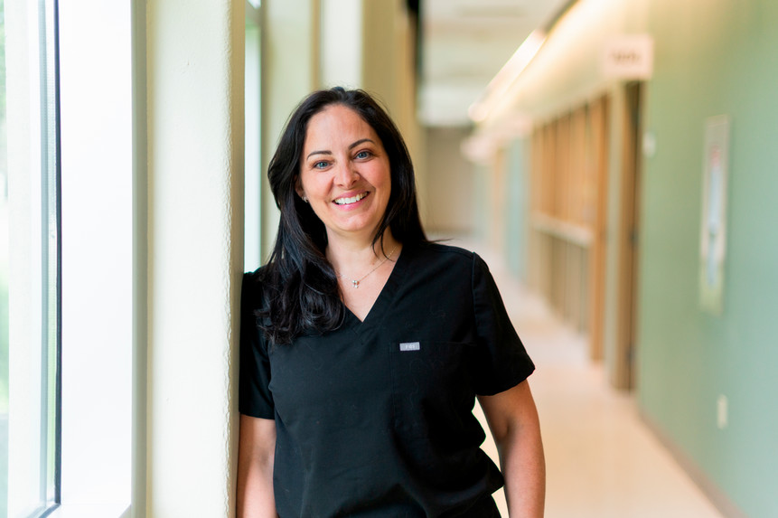 Dr. Josee Paradis smiling in a hallway at Schulich Medicine & Dentistry