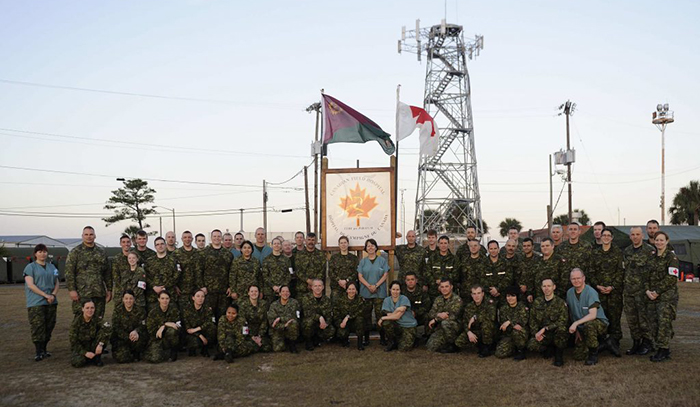 Image of Dr. McAlister on deployment (first row, far right)