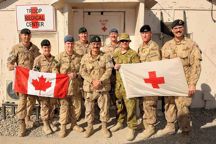 Image of Dr. Smith on deployment (far right)